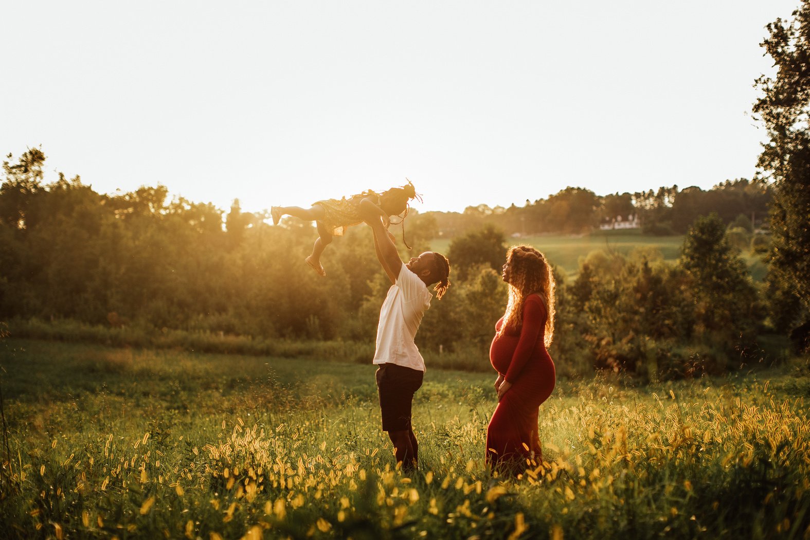 Family Photoshoot Set in Field over Sunset Outdoors 