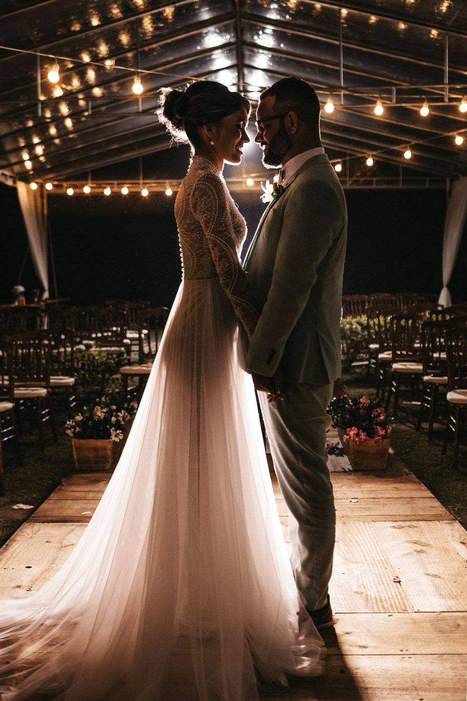 Man Standing in Front of Woman in White Wedding Dress